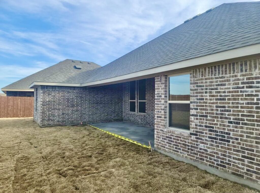 New gutters by Roof Experts on residential brick home in Allen TX