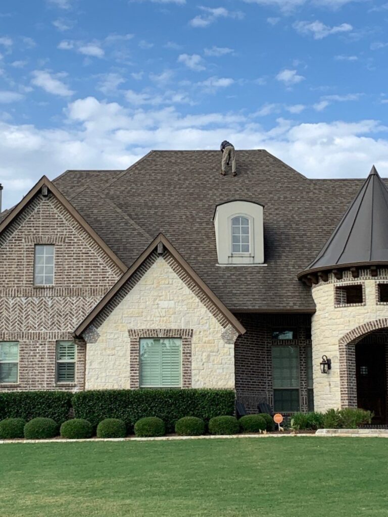 Asphalt shingle and metal residential roof by Roof Experts USA in McKinney TX