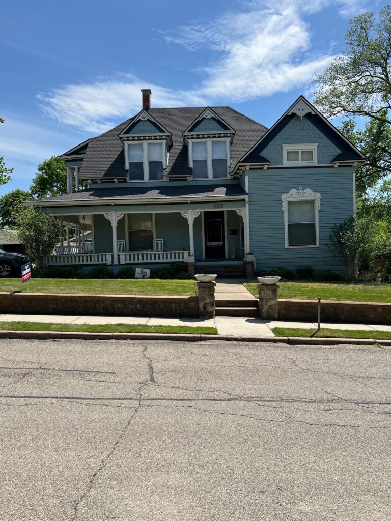 Completed residential roof replacement on a historic home in McKinney, TX