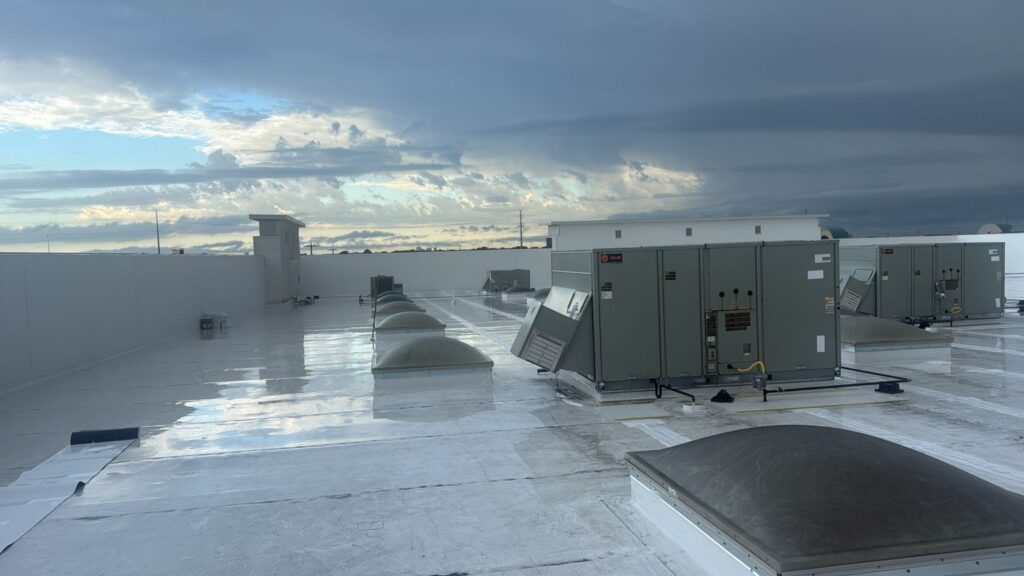 Commercial TPO roof with rooftop HVAC units serviced by Roof Experts in Garland, TX