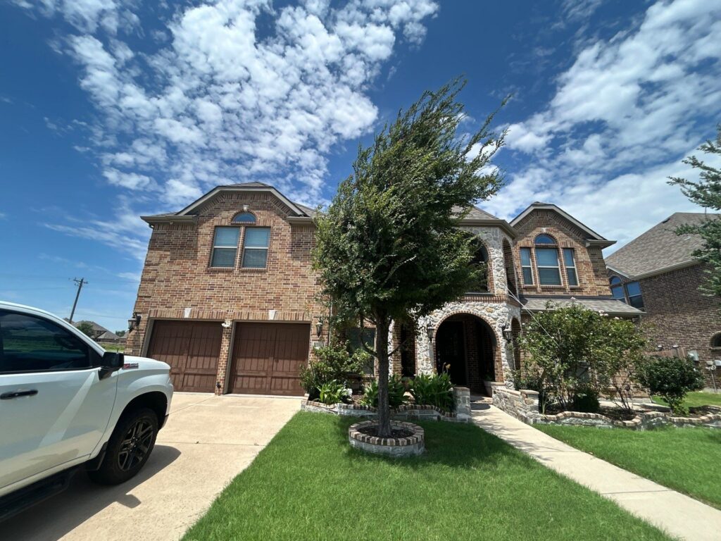 Completed roof repair on a two-story home in Frisco, TX