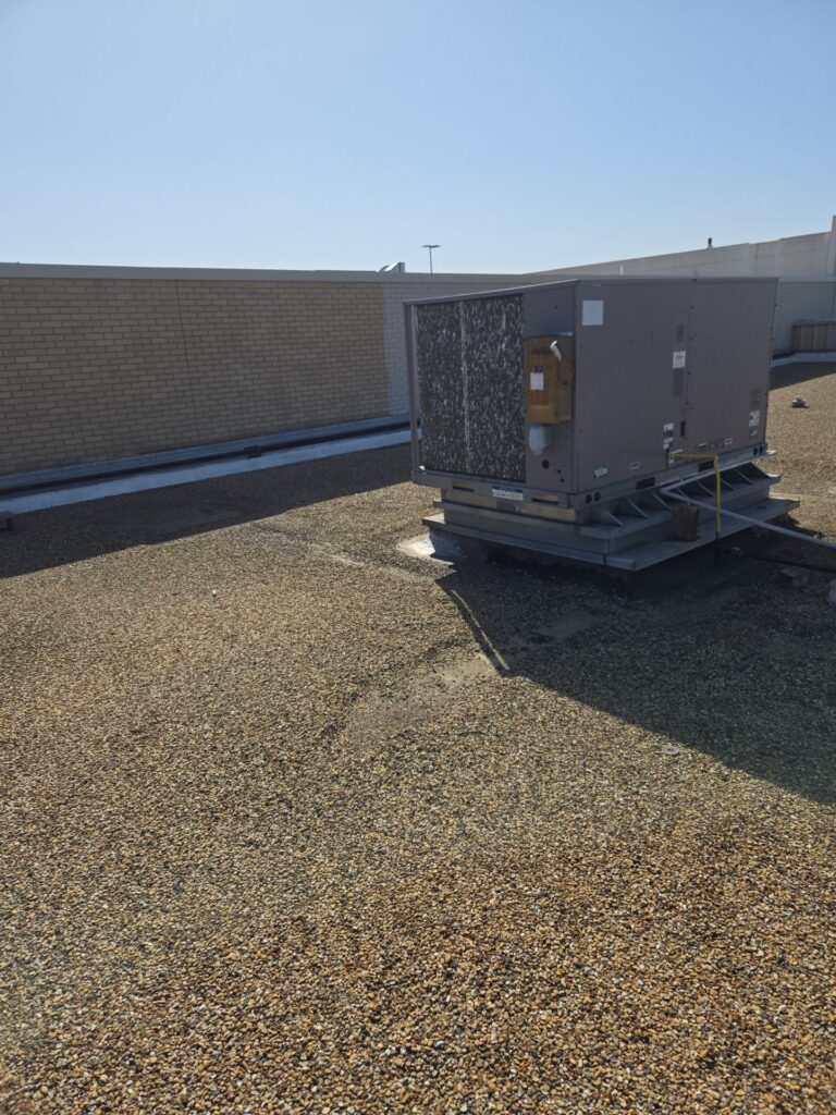 Commercial roof repair around a rooftop HVAC unit in Irving, TX